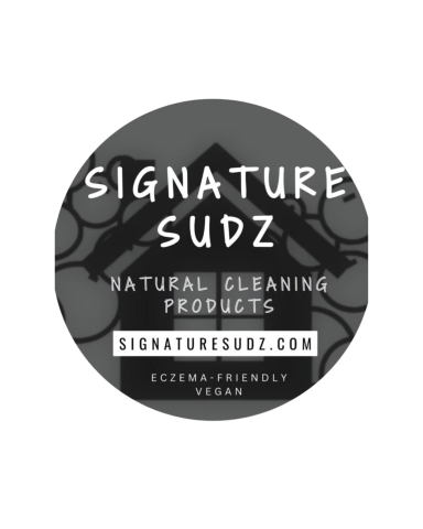 Black and white logo for Signature Sudz, featuring text and cleaning product imagery.